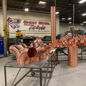 ARCHITECTURAL: Copper Spiral Duct Project “Shines Like a Diamond”