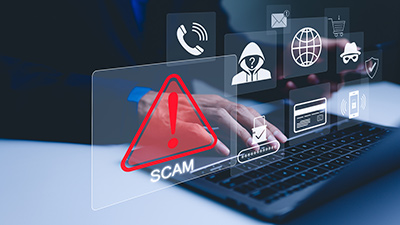 federated_phishing-400x225 Cybersecurity warning graphic showing a scam alert on a laptop.
