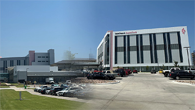 tabb-400x225 Exterior of a hospital with a parking lot