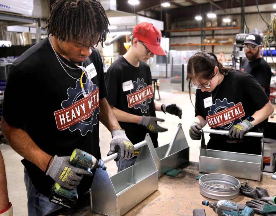 Heavy Metal Summer Experience Student with Trainer