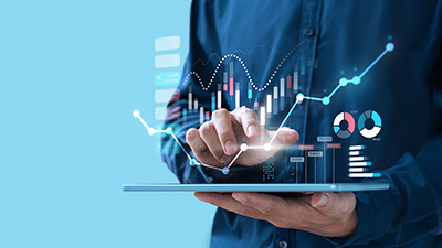 Business professional analyzing data charts on a tablet